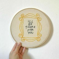 someone is holding up a small embroidery hoop with the words i'll be there for you