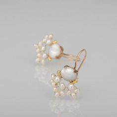 These handcrafted fan earrings are delicate, sparkling and whimsical. The unique copper bezel setting showcases the mother of pearl and beautiful hand-woven freshwater pearl underneath.These unique fan earrings seem to come straight from a fairy tale!The hook is gold filled.Measurements:Total length from top to bottom: approx. 2.6 cmWidth: 1.8cmA matching pearl necklace available here: https://etsy.me/3n76jRfSince I use natural gemstones, each jewel is unique and therefore there are subtle diffe Unique Pearl Earrings For Wedding, Unique Pearl Drop Earrings For Wedding, Unique Wedding Pearl Drop Earrings, Handmade Victorian Pearl Earrings For Gifts, Handmade Rose Gold Pearl Earrings For Wedding, Unique Handmade Pearl Earrings For Wedding, Unique Handmade Pearl Wedding Earrings, Delicate Jewelry With Matching Earrings For Celebration, Handmade Delicate Bridal Earrings For Formal Events