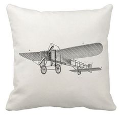 an old fashioned airplane flying in the sky on a white pillow with a black and white background