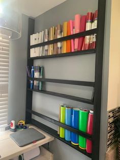 a room with shelves filled with different colored items