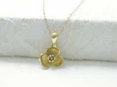 Gold flower necklace- simple dainty necklaceThree petal flower charm hangs on a dainty 14K gold filled chain.  Simple and dainty jewelry, a great everyday necklace.>>>measurements<< Gold Dainty Flower Pendant Charm Necklace, Yellow Gold Flower Charm Necklace With Delicate Chain, Dainty 14k Gold Charm Necklace With Flower Charm, Delicate Yellow Gold Flower Necklace With Delicate Chain, Gold Flower Charm Necklaces For Everyday, Everyday Gold Flower Necklace, Delicate Gold Flower Charm Necklaces, Delicate Gold Charm Necklaces With Flower Shape, Dainty Flower Charm Necklaces