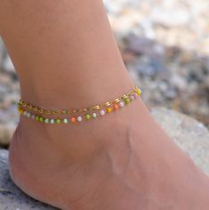 This coloful beaded chain anklet is for women. Its boho style makes it a great piece of summer jewelry. The ankle bracelets have an extension so the size can be adjusted. They can be worn seperately or as an anklet set. Multicolor Beaded Chain Anklets As Gift, Trendy Handmade Multicolor Anklets, Trendy Multicolor Handmade Anklets, Bohemian Beaded Anklets For Beach, Multicolor Beaded Anklets For Vacation, Multicolor Beaded Anklets For Summer, Summer Multicolor Beaded Anklets, Bohemian Beaded Chain Anklets For Festivals, Gold Anklets With Colorful Beads For Summer