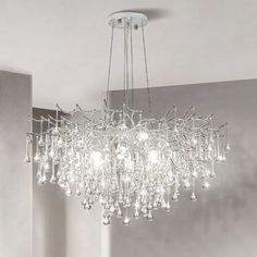 a chandelier hanging from the ceiling in a room