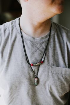 This adjustable necklace features a hand carved and painted stone tube bead with Buddha's Wisdom Eyes and the mantra of compassion carved into it. Many of our customers have told us that this necklace reminds them directly of their travels to Nepal or their fondness for Himalayan culture. Unlike most of our items, these necklaces aren't actually exclusive to DharmaShop. You can find these in many shops in Thamel where hikers and trekkers often go before heading to Everest Base Camp. We are happy Mantra Necklace, Buddha Wisdom, Om Mani Padme Hum, Painted Stone, Base Camp, Eye Design, Tube Beads, Adjustable Necklace, Himalayan