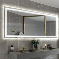 a bathroom with two sinks and a large mirror