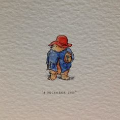 a drawing of a bear wearing a red hat and blue jacket with the words, i'm december 2011 on it