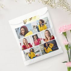 a white paper bag with photos of women in yellow and black on it next to pink flowers