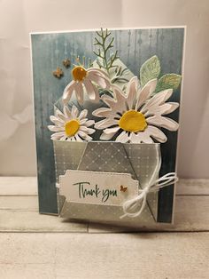 a thank you card with daisies in a vase