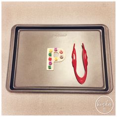 a baking pan with some food on it and the letters f spelled out in different colors