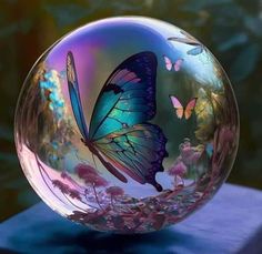 a glass ball with a butterfly painted on it