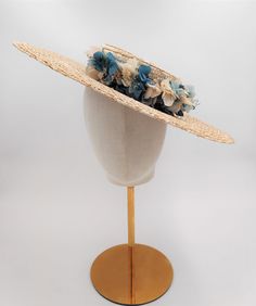 Wide brim straw hat decorated with preserved flowers in shades of green and blue. This beautiful hat is ideal for any occasion. An elegant hat for weddings, social events, horse races and summer parties. *Design : This hat is made with high quality materials , using traditional millinery tecniques. all our hats are hand sewn and so each hat is unique. *Description : With a flat brim and low oval top attached to the head with a hair matching millinery elastic, worn around the back of the head and Elegant Hat With Structured Crown In Natural Color, Elegant Natural Hat With Structured Crown, Summer Straw Hat With Structured Crown, Summer Straw Hat With Structured Crown In Beige, Beige Straw Hat With Structured Crown For Summer, Beige Structured Crown Straw Hat For Summer, Spring Straw Panama Hat With Structured Crown, Kentucky Derby Straw Hat With Structured Crown, Spring Beach Boater Hat With Structured Crown