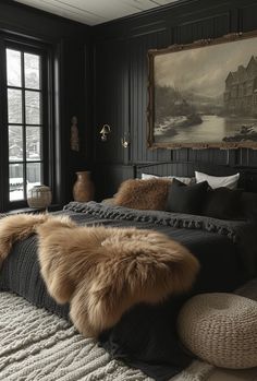 a bedroom with black walls and fur on the bed