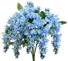 blue flowers are in a vase with green leaves