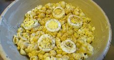 a bowl filled with macaroni and cheese on top of a table