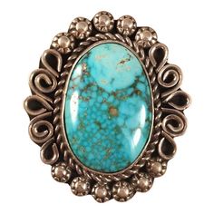 JEWELRY TYPE : Rings METAL : Sterling Silver COUNTRY OF ORIGIN : United States METAL PURITY : .925 SIGNED? : Signed TRIBAL AFFILIATION : Navajo RING SIZE : 6.5 MAIN STONE : Turquoise ARTISAN : Alice Johnson p.p1 {margin: 0.0px 0.0px 8.0px 0.0px; line-height: 28.0px; font: 17.0px Helvetica; color: #000000; -webkit-text-stroke: #000000; min-height: 19.6px}p.p2 {margin: 0.0px 0.0px 8.0px 0.0px; line-height: 28.0px; font: 17.0px Helvetica; color: #000000; -webkit-text-stroke: #000000}span.s1 {font-f Sterling Silver Turquoise Rings With Concho Detail, Sterling Silver Turquoise Ring With Concho, Western Sterling Silver Turquoise Concho Ring, Western Style Turquoise Sterling Silver Ring, Western Style Sterling Silver Gemstone Ring, Southwestern Sterling Silver Rings With Large Stone, Western Sterling Silver Gemstone Ring, Silver Oval Turquoise Ring With Concho, Southwestern Sterling Silver Ring With Large Stone