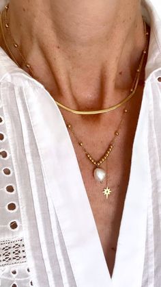 It's all in the detail for this gorgeous two-layer necklace in 14K gold-plated stainless steel, adorned with a Freshwater Pearl and a hanging star. It's perfect for dressing up or adding a touch of glamour to your everyday style Length: 15 to 17 inches with extender Gold Plated Necklaces With Star Charm, Elegant Gold Chain Necklace With Star Charm, Elegant Gold Necklace With Star Charm, Layer Necklace, Dressing Up, Pitcairn Islands, Guinea Bissau, Everyday Style, Caribbean Netherlands