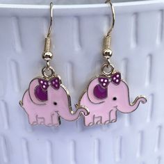 Adorable pink novelty elephant earrings these come on gold plated hooks these make a great gift for lovers of fun quirky earrings. Not suitable for young children due to choking hazard I have lots of other fun earrings  https://hilarysgifts.etsy.com    Please use code SAVE10 when purchasing 5 items from my store for 10% off Nickel-free Pink Earrings For Birthday, Cute Earrings For Pierced Ears For Mother's Day, Playful Personalized Pink Earrings, Adjustable Kawaii Dangle Earrings, Cute Adjustable Earrings For Mother's Day, Playful Pink Earrings With Cute Design, Adjustable Jewelry With Cute Design Gift, Whimsical Nickel-free Pink Earrings, Whimsical Pink Nickel-free Earrings