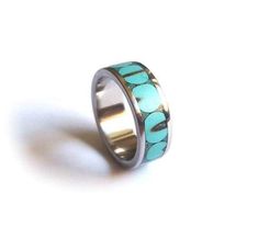 Stainless Steel ring inlaid with crushed turquoise bits. Pretty boho chic style that will be the perfect accesorie for your summer look.  All ring is unique, handmade product, so every pieces is a little different. The cause of the different look is the ingredients mineral stones placement. Please make sure about your right size before ordering. Modern Turquoise Round Ring, Bohemian Turquoise Ring With Inlay For Anniversary, Bohemian Turquoise Inlay Ring For Anniversary, Turquoise Inlay Rings As A Gift, Modern Turquoise Ring For A Gift, Turquoise Inlay Ring As A Gift, Modern Turquoise Ring For Gift, Modern Turquoise Ring As Gift, Turquoise Inlay Ring As Gift