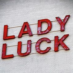 a sign that says lady luck on the side of a building