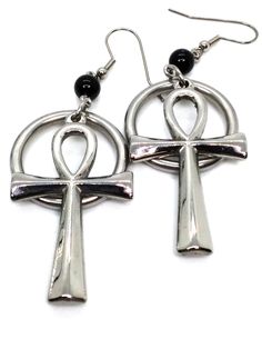 Made to Order! An enduring staple of the goth subculture, these ankh earrings are a goth jewelry cornerstone for your wardrobe. Accompanied by stainless steel o-rings, these ankhs are made of stainless steel and will not tarnish over time. The rings are included to evoke the solar imagery in ancient Egyptian culture and satisfy the goth obsession with hardware! The sturdy construction and simple beauty of these earrings make a reliable piece that you won't want to leave home without. The shiny Trad Goth Fashion, Ankh Earrings, Staple Earrings, Goth Subculture, Trad Goth, Goth Earrings, Egyptian Culture, Goth Jewelry, Ring Der O