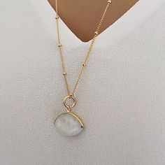 Long Moonstone Gold Necklace for layering 14k Gold Filled Satellite chain - Jewelry gift ideas for wife, mom, bride, bridesmaids, girlfriend Gemstone: Genuine Moonstone Pendant Size: 20x15mm Bezel: Vermeil Gold Chain: Satellite Chain: 14K Gold Filled with spring ring clasp Chain: 1mm Length: 24 inches About "Gold Filled Jewelry": Also called rolled-gold. These jewelry items are not actually filled with gold. They are made of a base metal covered by sheets of gold in a mechanical bonding process. Delicate Round Gemstone Crystal Necklaces, Gold Moonstone Round Jewelry, Gold Minimalist Moonstone Jewelry, Minimalist Round Birthstone Crystal Necklaces, Minimalist Crystal Birthstone Necklaces, Minimalist Jewelry With Round Pendant And Natural Stones, Minimalist Jewelry With Natural Stones In Round Pendant, Minimalist Jewelry With Natural Stone Round Pendant, Gold Moonstone Necklaces For Anniversary