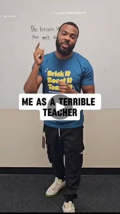 a man standing in front of a whiteboard with the words me as a terrible teacher