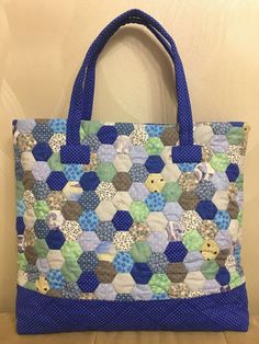 a blue and white bag sitting on top of a table