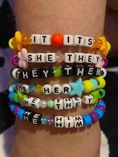 Custom personalized pronoun bracelets. All pronouns are welcomed! Our shop (+this listing) is a judgement free, welcoming zone ! Your arm will look beautiful in our amazing custom patterned kandi bracelets <3 We offer all colors of the rainbow, plus a few extra shades, and various specialty beads. If you have something specific in mind, please message us beforehand to see if it's possible! Please refer to the last photo to see an example of our variety :D Check out our shop for more listings: Pronoun Bracelets, Bracelets Kandi, Rave Bracelets, All Pronouns, Kandi Beads, Diy Kandi Bracelets, Pony Bead Bracelets, Diy Kandi, Kandi Kid