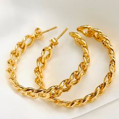 ⭐️Item Description: Size: 35 x 5mm Material: 18K Gold Filled Benefits: Water & Tarnish Resistant, Hypoallergenic ⭐️About Our Hoops: Our hoop collection ranges in shape, size, and design in order to effectively draw attention to the beautiful features of your face. They have the power of making you feel stylish, powerful, and daring in all types of outfit ⭐️Guide to a More Flattering Look: - Huggies & Small Hoops Under 20mm: These are excellent for a causal everyday wear. They are subtle Gold Hoop Earrings With Cable Chain For Gift, Gold Hoop Earrings With Gold Chain For Gift, Metal Chain Hoop Earrings For Gift, Metal Chain Hoop Earrings As Gift, Chain Hoop Earrings For Gifts, Hoop Chain Earrings For Gift, Adjustable Chain Hoop Earrings As Gift, Gold Hoop Earrings With Gold Chain For Everyday, Hoop Earrings As Gift