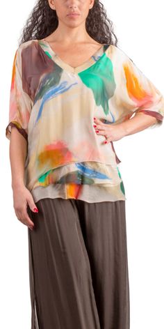 Abstract Painted Design on 100% Silk Blouse with Frayed Raw Edge Hemline. Soft, Stretchy Viscose Layer Underneath. 100% Silk Exterior | 95% Viscose | 5% Elastic Interior Made in Italy Fits Sizes XS- XL Model 5'7 Summer Beige Silk Blouse, Beige Silk Blouse For Summer, Spring Multicolor Viscose Blouse, Chic Multicolor Viscose Blouse, Summer Beige Viscose Blouse, Multicolor Silk V-neck Top, Beige Viscose Summer Blouse, Flowy Silk Blouse For Spring, Multicolor Silk Short Sleeve Top