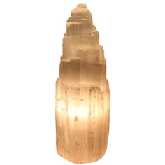 Electric Selenite Lamp Add a crisp light to your home with these electric lamps made from natural selenite. The pure white stone as a warm glow as the light bulb glows from within. These lamps come in small and large sizes. Material: Selenite and wood Dimensions: Small 3.25 diameter X 6.75-8 inches tall, Large 3.5 diameter X 10 inches tall 886354358000 Electric Selenite Lamp Add a crisp light to your home with these electric lamps made from natural selenite. The pure white stone as a warm glow a Selenite Lamp, Electric Lamp, The Pure, White Stone, Edison Light Bulbs, Pure White, Wall Hooks, Light Bulb, Lamps