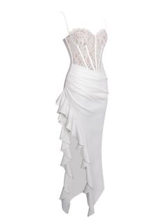 a white dress with ruffles on the bottom