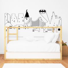 the batman wall decal is in front of a bed