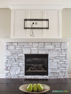 two pears on a plate in front of a fireplace with a basketball hoop above it