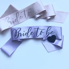 "- Please note that the pin shape and colour will be selected randomly depeding on the stocks. Heart or diamond shaped pins will be sent in gold, silver, black or white colour.Bride to be sash, Purple bachelorette sash, Hen party sash with pin, Bridesmaid gift, Bachelorette party favor, Personalised lilac hen sash - A very classy hens party sash with black \"Bride to be\" print on double face satin ribbon. - You can personalise this sash with your own colors and wording - It is open ended and co Purple Bachelorette Party, Purple Bachelorette, Elegant Bachelorette Party, Classy Hen Party, Hen Party Sash, Bachelorette Party Accessories, Gold Bachelorette, Bachelorette Sash, Bridesmaid Sash