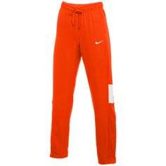 A TRAIN AND TRAVEL ESSENTIAL. Warm up or cool down in the Nike Dri-FIT Pants. The sweat-wicking fabric helps you stay dry and comfortable, while the lower leg button placket lets you change easily over shoes. Dri-FIT technology helps keep you dry, comfortable and focused. Soft, woven fabric lets you move freely. A 3-button placket with snaps on the lower legs make it easy to change over shoes. Side pockets for stashing your small items. Waistband with drawcord secures a snug fit. 100% polyester Team Orange, Lower Leg, Fit Pants, A Train, Orange White, Small Items, Button Placket, Nike Dri Fit, Workout Pants