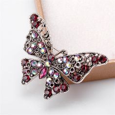 Adorn your lapel or bag with a touch of glam thanks to the glittering cubic zirconia embellishments of this elegant brooch. 2.1'' W x 1.5'' H Silver-plated copper / cubic zirconia Rhinestone Outfit, Cerise Pink, Purple Rhinestone, Butterfly Brooch, Brooch Jewelry, Crystal Brooch, Vintage Butterfly, Pink Butterfly, Gifts For Wedding Party