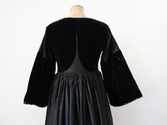 Late 19th century two-piece Breton costume. A rare and collectible piece.  The dress is a black cotton with silk velvet panels. The inner bodice lining is a indigo cotton. Fastens with metal hook and eyes at the front. Beautiful pleats at the back. It has velvet brush at the hem. The sleeves are a trumpet shape. Two open side slots at the hips. Inside pocket. This would have had an apron worn over the front.  The velvet overlay vest is an amazing shape which holds it structured form. Lined in in Traditional Victorian Dress For Costume Party, Victorian Evening Dress With Historical Design, Black Historical Victorian Costume Dress, Historical Black Victorian Costume Dress, Traditional Fitted Victorian Dress For Costume Party, Traditional Long Sleeve Fitted Victorian Dress, Traditional Fitted Long Sleeve Victorian Dress, Black Regency Style Victorian Costume Dress, Traditional Victorian Costume Dress