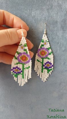 These handmade unique earrings with abstract floral print are made of high-quality Czech beads and strong synthetic thread. I use my author's scheme . They are elegant, fashionable, and highly versatile, suitable for everyday wear. Color: white,pink,purple,red,orange, green . 100% hand made with love! I beg you not to copy my authoring Copy without my permission is prohibited For those who want to buy my copyright scheme for these earrings: https://www.etsy.com/uk/listing/974991392/brick-stitch- Traditional White Flower Earrings, White Dangle Flower Earrings With Colorful Beads, White Bohemian Beaded Dangle Earrings, White Flower Dangle Earrings With Colorful Beads, White Beaded Adjustable Flower Earrings, White Flower Shaped Beaded Earrings With Colorful Beads, White Dangle Flower Earrings With Beads, Handmade White Bohemian Earrings, White Handmade Bohemian Earrings