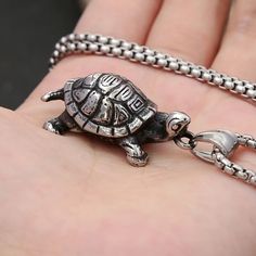 Introducing our Little Turtle Stainless Steel Necklace, a charming accessory that embodies resilience and grace. Crafted with high-quality stainless steel, this necklace features a petite turtle pendant, symbolizing longevity and protection. Wear it as a reminder of inner strength and perseverance. SPECIFICATIONS Metal Type: STAINLESS STEEL Gender: Unisex Length: 60cm Turtle Pendant, Steel Necklace, Inner Strength, Stainless Steel Necklace, Types Of Metal, Stainless Steel, Chain, Pendant, How To Wear