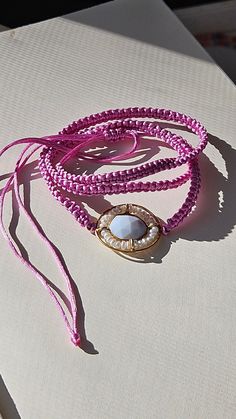 Handmade satin macrame magenta double wrap bracelet with pearl and moonstone pendant. * M A T E R I A L * Main stone : Natural Freshwater Pearl Closure & Findings :satin rattail cord * D I M E N S I O N * Length: 7 inches with extension * A B O U T * Nik's Petite Shop https://www.etsy.com/shop/NiksPetiteShop#about M O R E * FROM * SHOP  https://www.etsy.com/shop/NiksPetiteShop * FOLLOW * US IG: @nikspetiteshop Thank you so much for visiting and hope you enjoy shopping here at NPS. Feel free to c Bohemian Bracelets With Adjustable Pearl Charm, Bohemian Bracelet With Adjustable Pearl Charm, Adjustable Bohemian Bracelet With Pearl Charm, Bohemian Adjustable Bracelet With Pearl Charm, Beachy Jewelry, Bracelet Macrame, Double Wrap Bracelet, Bracelet Pearl, Macrame Bracelet