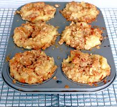 a muffin tin filled with lots of food on top of a cooling rack