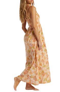 This summery cotton sundress is designed in a shoulder-baring silhouette with an allover floral print and a smocked bodice. 52" center length (size medium) Slips on over head One-shoulder neck Adjustable strap Partially lined 100% cotton Machine wash, tumble dry Imported Summer Peach Strapless Dress, Peach Strapless Summer Dress, Peach Strapless Dress For Summer, Off-shoulder Maxi Dress With Smocked Back For Beach, Summer Tropical Dress With Smocked Back, Spring Tropical Dress With Smocked Back, Tropical Beach Dress With Smocked Bodice, Peach Summer Maxi Dress For The Beach, Cotton Strapless Sundress For Vacation