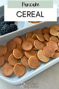 pancake cereal with berries and blackberries on the side in a baking dish, ready to be eaten