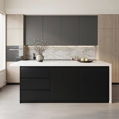 a modern kitchen with marble counter tops and black cabinetry, along with white flooring