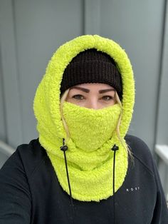 Balaclava - Sherpa FITS OVER HELMET! Fits over most adult helmets as well as over beanies  Hood made with Sherpa fleece Stay warm in style!  Wear with hood up or down, and face mask up or down  Pull strings with cord stops to stay tight  Adult size, fits most!  Beanie hat not included  100% polyester   Dry clean only!  *Pattern placement may vary Windproof Hats For Outdoor Winter Wear, Windproof Winter Hats For Outdoor, Winter Wear Windproof Hats For Outdoor, Casual Full Face Windproof Hat, Winter Windproof Beanie For Outdoor Activities, Hooded Outdoor Hat, One Size Fits Most, Windproof Full-face Hat For Cold Weather, Warm Winter Balaclava For Streetwear, Windproof Full Face Hat For Cold Weather