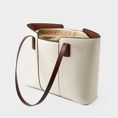 Gender: Women Type: Tote Bag Features: Adjustable Strap, Inner Pockets Main Materials: Cowhide Lining: Polyester Type of Closure: Zipper Style: Casual, Daily, Stylish Size: Length: 40 cm / 15.75 " Width: 28 cm / 11.02 " Height: 12 cm / 4.72 " Cream Leather Bucket Satchel, Beige Box Bag With Leather Handles For Shopping, Large Capacity Leather Beige Bucket Bag, Beige Leather Bucket Bag For Office, Large Capacity Beige Leather Bucket Bag, Large Capacity Cream Leather Bucket Bag, White Leather Bucket Box Bag, Beige Faux Leather Hobo Bag With Large Capacity, White Faux Leather Shoulder Bag For Everyday Use