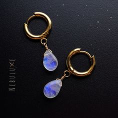 ✨ Step into a world of enchantment with our rainbow moonstone hoop earrings. Crafted to perfection, these hoops feature mesmerizing rainbow moonstones that shimmer with ethereal beauty. Known for their mystical properties and connection to intuition, rainbow moonstones add a touch of magic to any ensemble ✨ ⭒ Ball Studs:  4mm ball/15mm post * 925 Sterling Silver ⭒ Ball Stud pushbacks: butterfly backing encased in silicone ⭒ Hoops:  10mm/14mm * Stainless Steel ⭒ Hooks:  2'/5cm long * 925 Sterling Celestial Hoop Jewelry As Gift, Round Moonstone Hoop Earrings As A Gift, Moonstone Hoop Earrings Gift, Gold Moonstone Dangle Hoop Earrings, Moonstone Dangle Hoop Earrings As Gift, Moonstone Dangle Hoop Earrings For Gift, Celestial Hoop Hypoallergenic Jewelry, Celestial Style Hypoallergenic Hoop Jewelry, Celestial Hypoallergenic Hoop Jewelry