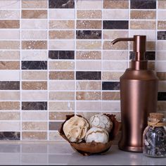 a bathroom counter with soap dispenser, toiletries and other items on it