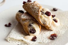 two cranberry filled pastries on a white plate